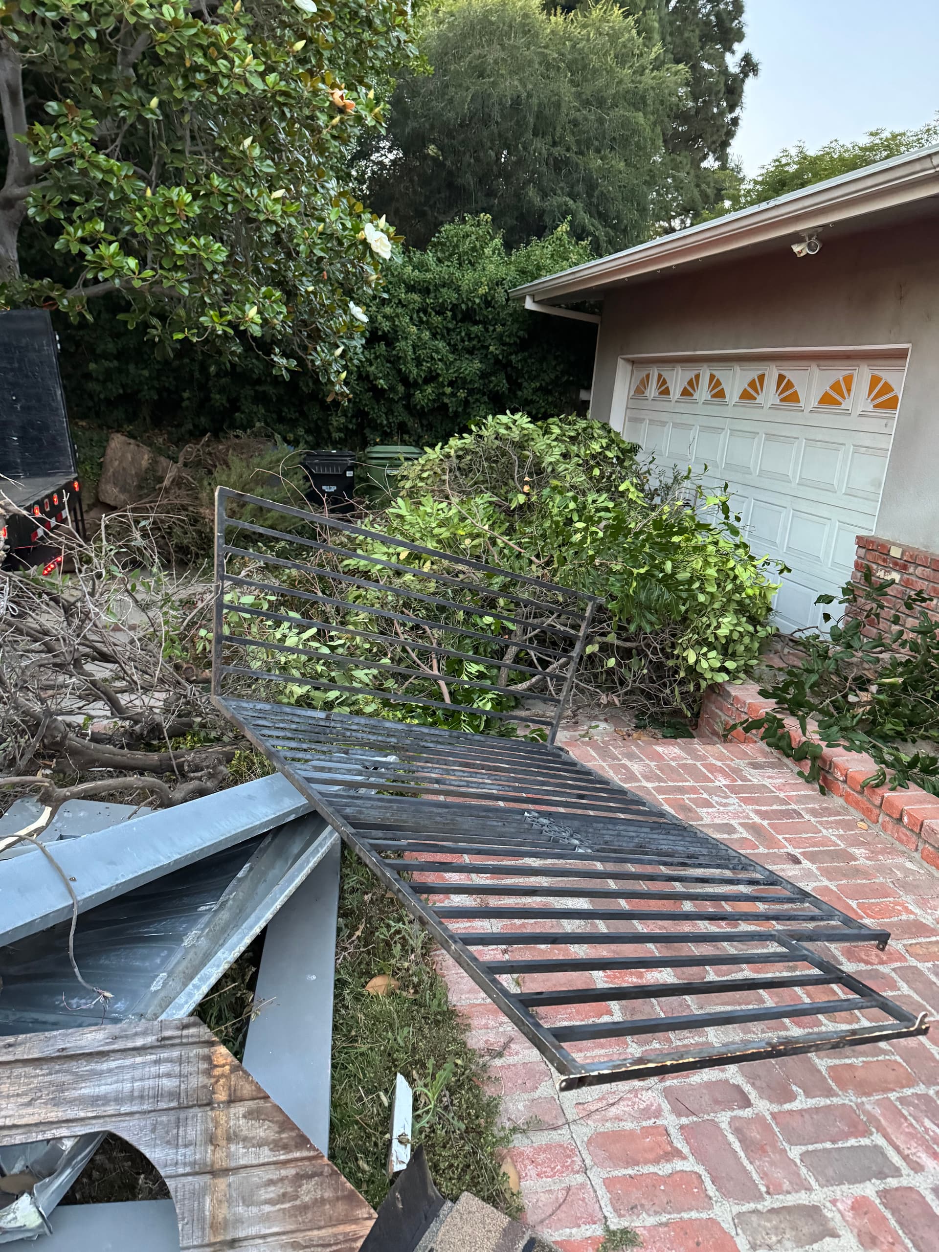 Driveway Cleanup in Toluca Lake - Brush and Metal Gates Gone image