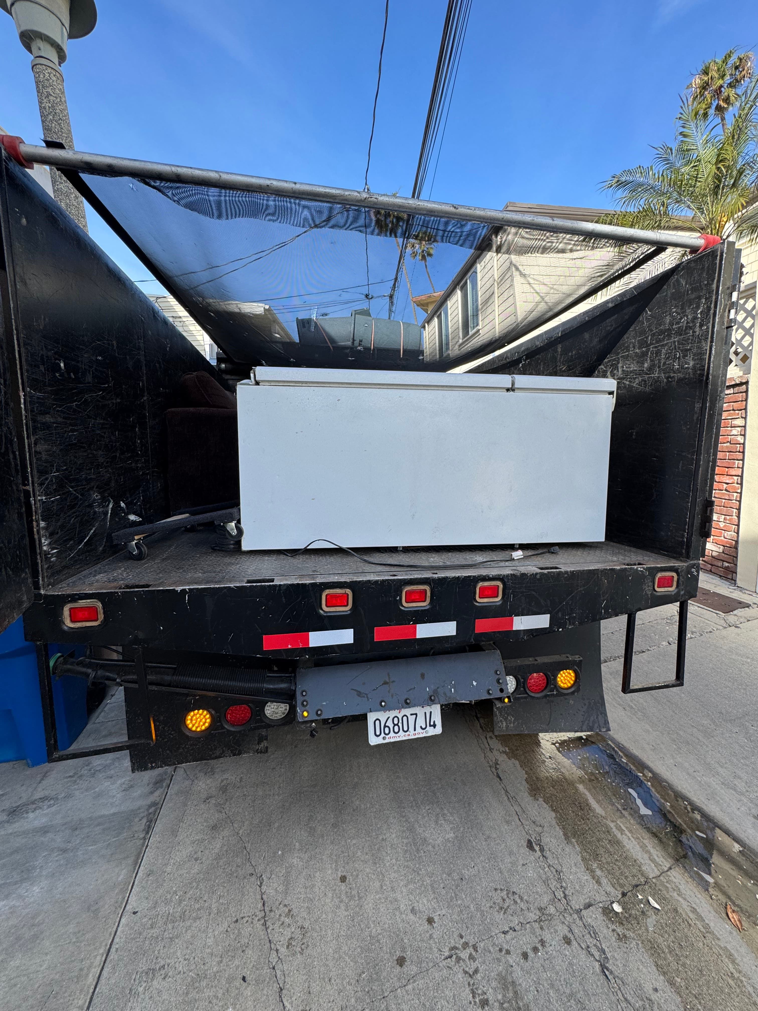 Project Old refrigerator out the door in Long Beach Naples image